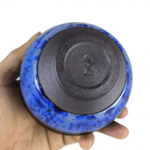 tenmoku-glaze-cup-tea-blue-onhand.png