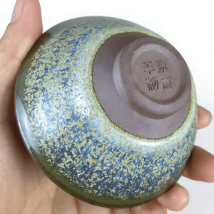 porcelain-tea-cups-ricewine-inhand.png