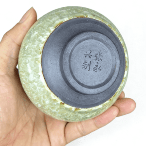 tenmoku-glaze-cup-tea-rice-inhand.png