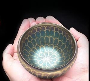 tenmoku-glaze-buddha-lotus-inhand.jpg