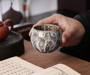tenmoku-glaze-porcelain-tea-cups-spindrift-inhand